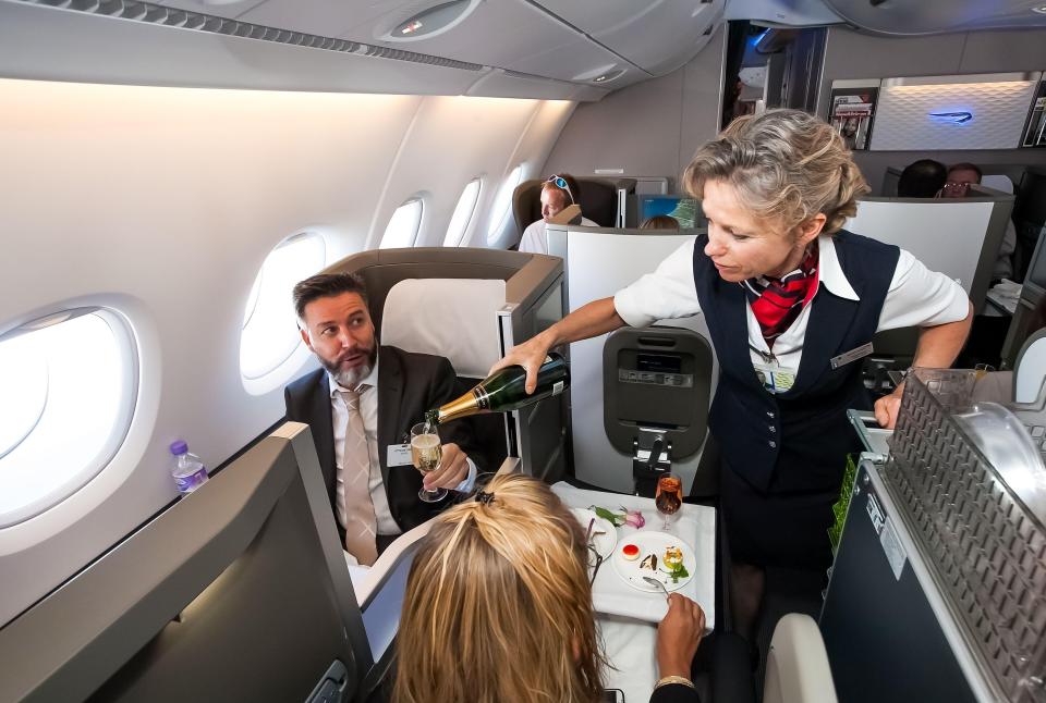 Business-class seats often come with extra perks include lie-flat seats and three-course meals