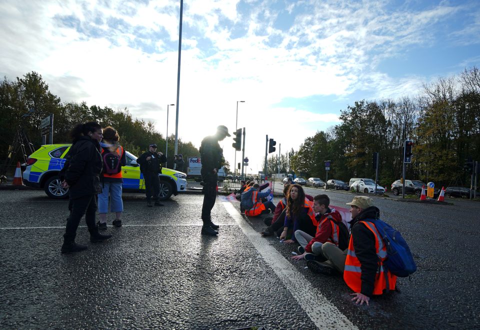 Insulate Britain protesters sat across the road in Manchester