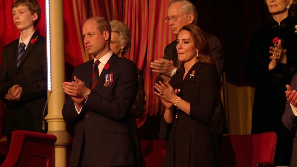 Kate and William stand and applaud one performance