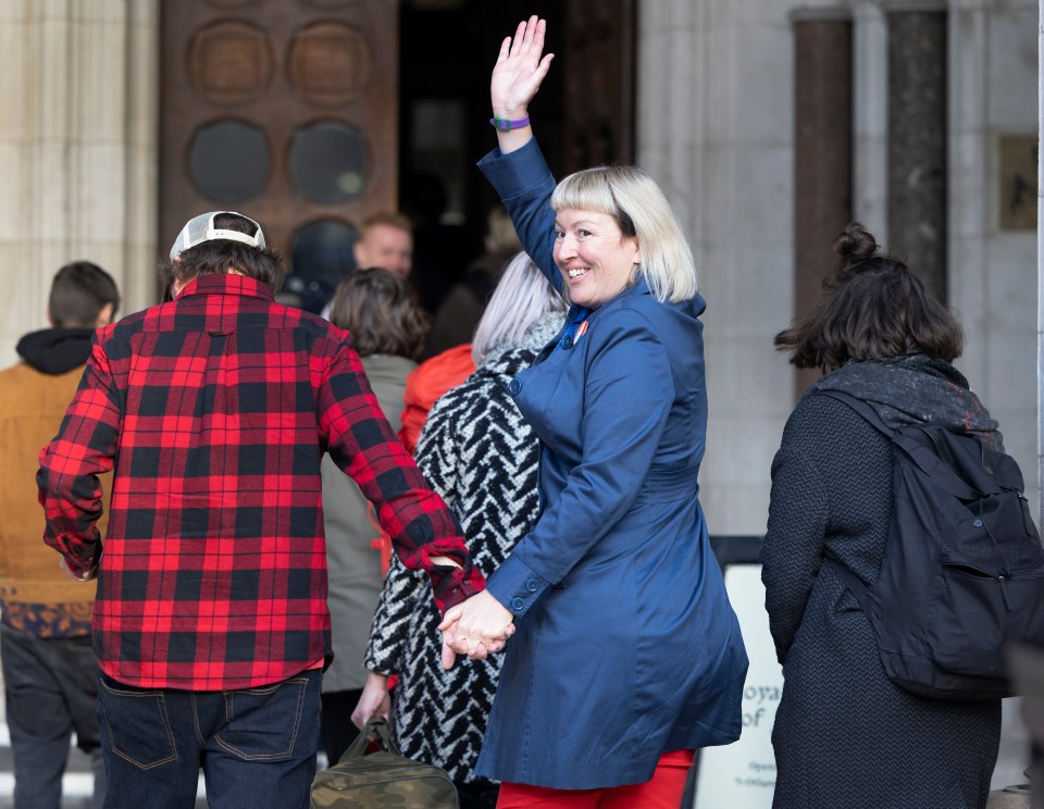 Emma Smart is seen waving to loved ones outside court today