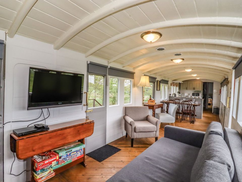 It has an open plan living space, kitchen, dining table and double bedroom