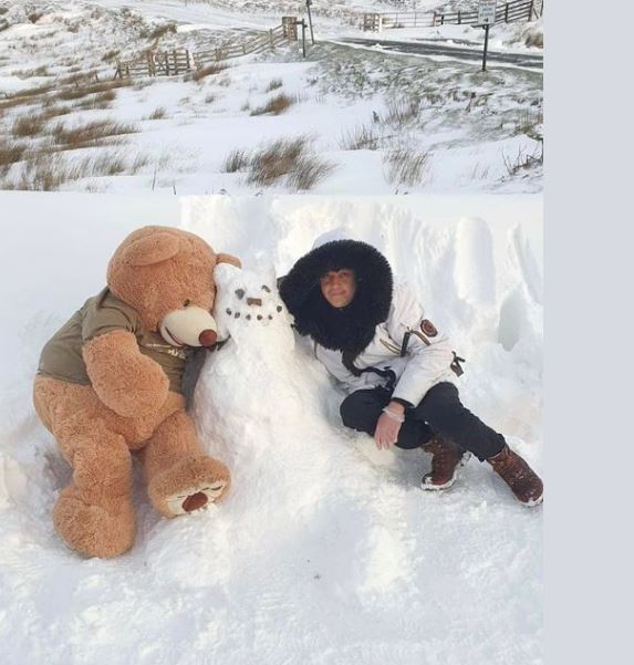 Stranded punters have amused themselves by making snowmen