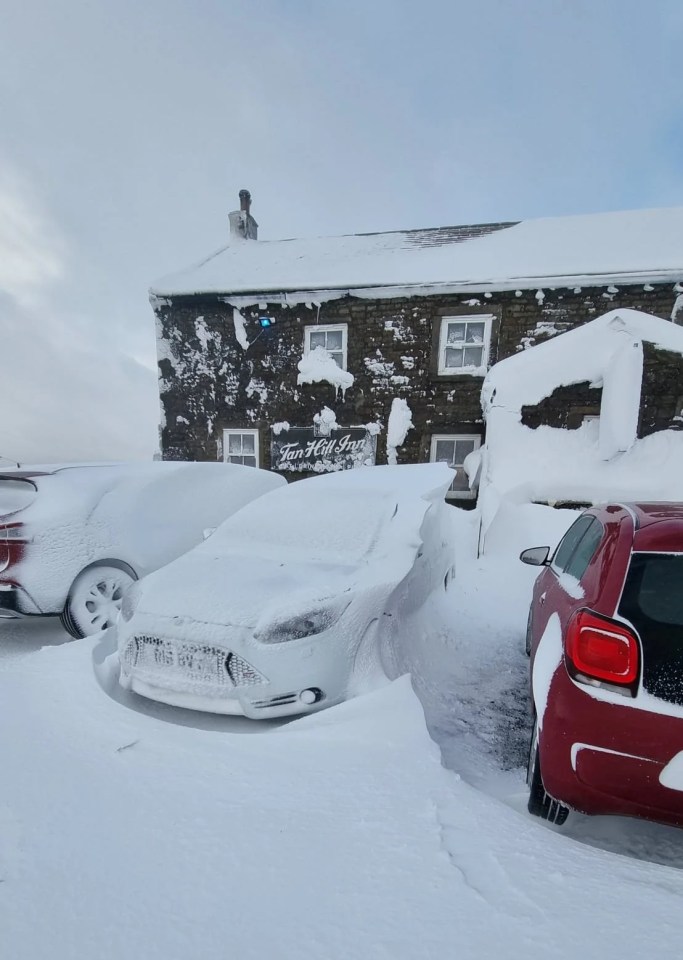 Vehicles were left covered in snow after blizzards blew in