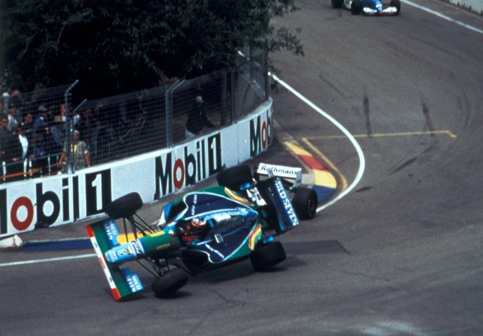 Michael Schumacher was knocked onto two wheels after a run in with Hill