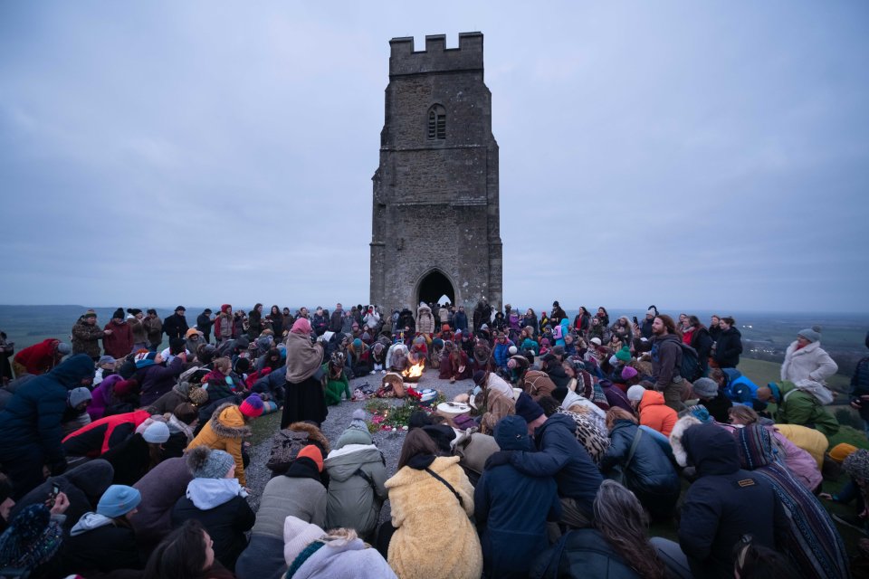 Crowds gathered at Glastonbury Tor to greet the winter solstice