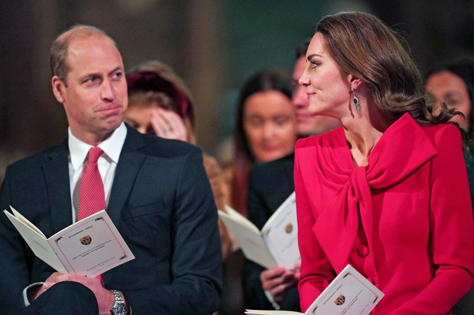Kate wore in a red Catherine Walker coat and sapphire diamond fringed earrings