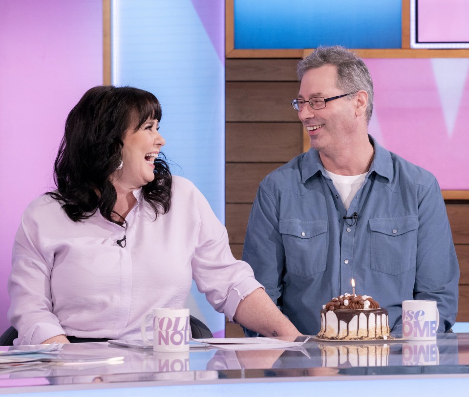 The Loose Women star presented Michael with a cake on his 58th birthday