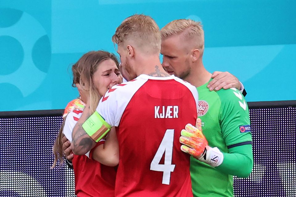 Kasper Schmeichel and Simon Kjaer comfort Sabrina Kvist Jensen, partner of Christian Eriksen