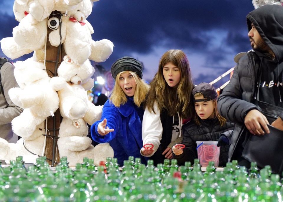 They were snapped playing games at the London theme park