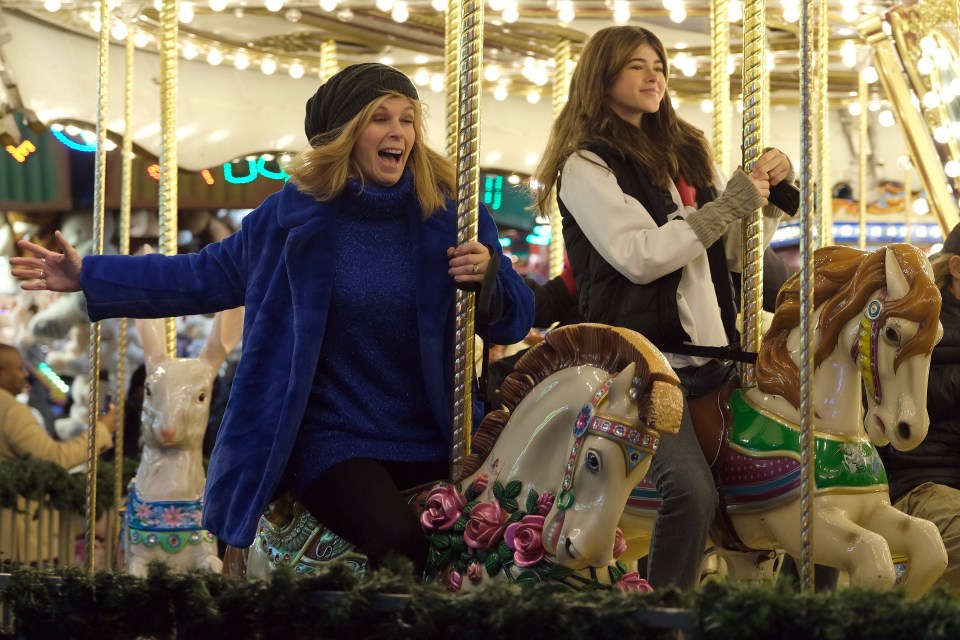 Kate Garraway with her daughter Darcey on the carousel at Winter Wonderland