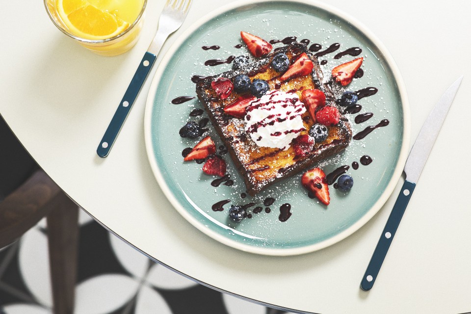 French toast with berries and whipped cream.