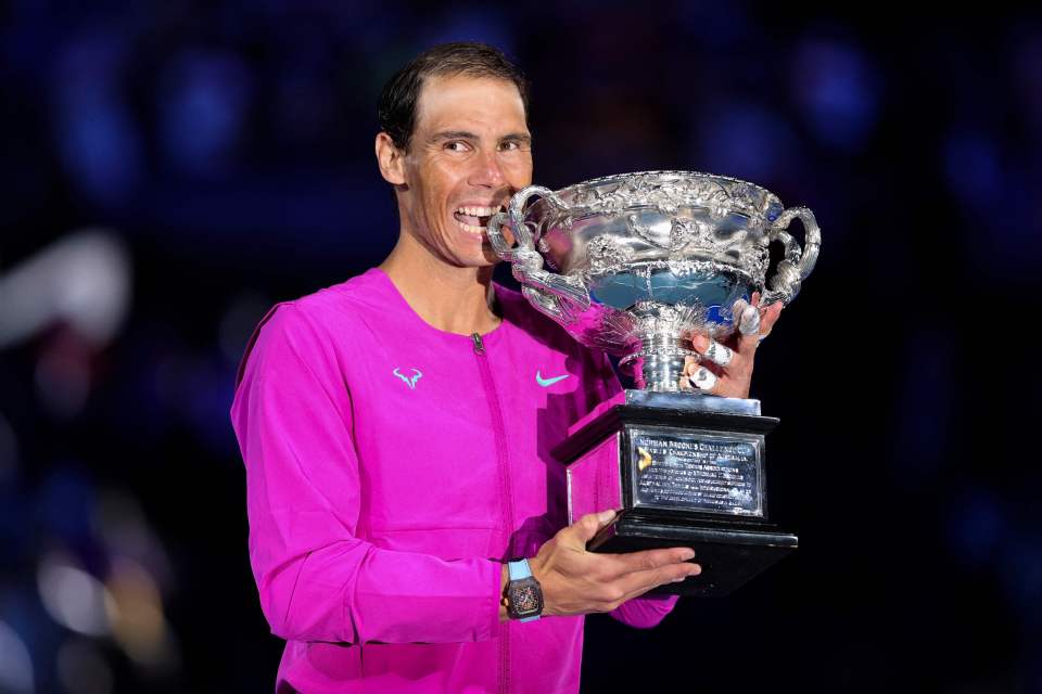 Nadal did his trademark celebration by biting the Norman Brooks Challenge Cup