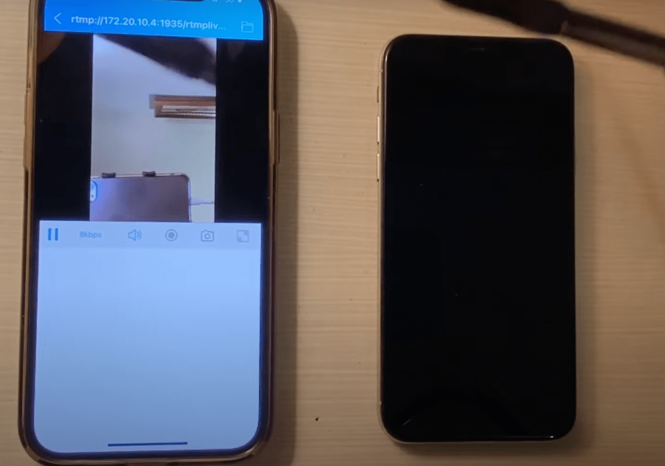 Phone on left shows what camera sees on phone to the right, even though it appears off
