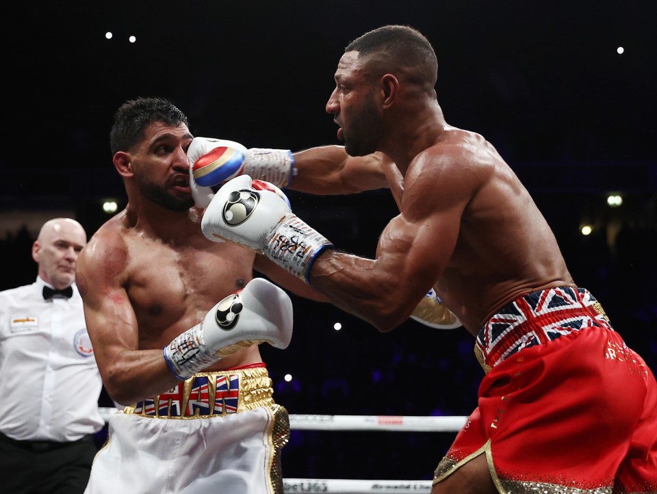 Amir Khan's face is distorted by Kell Brook's punch