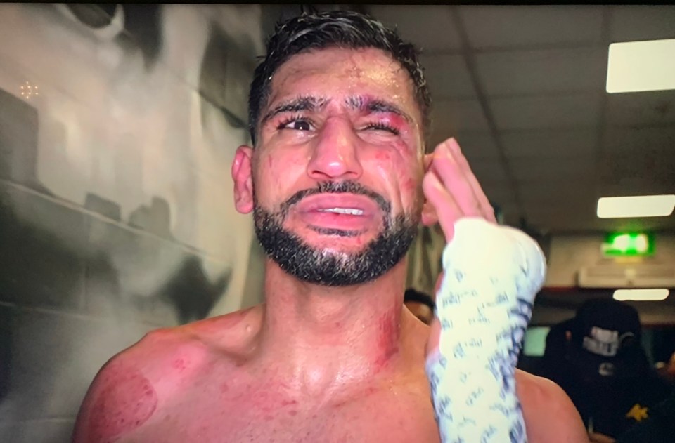Amir Khan looked to be in pain after his stunning defeat