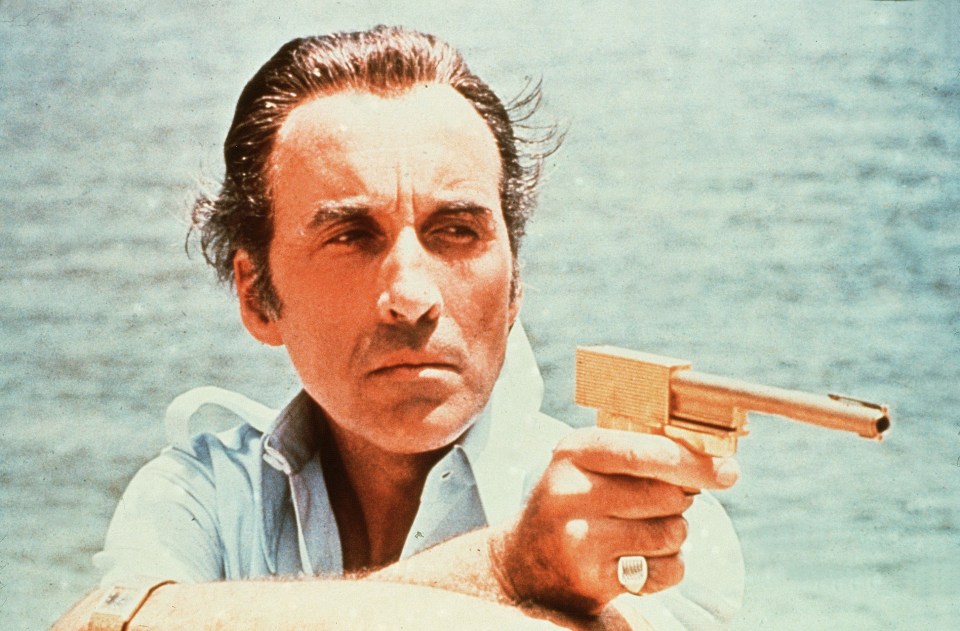 Sir Christopher Lee, who has signed the replica weapon, in The Man with the Golden Gun