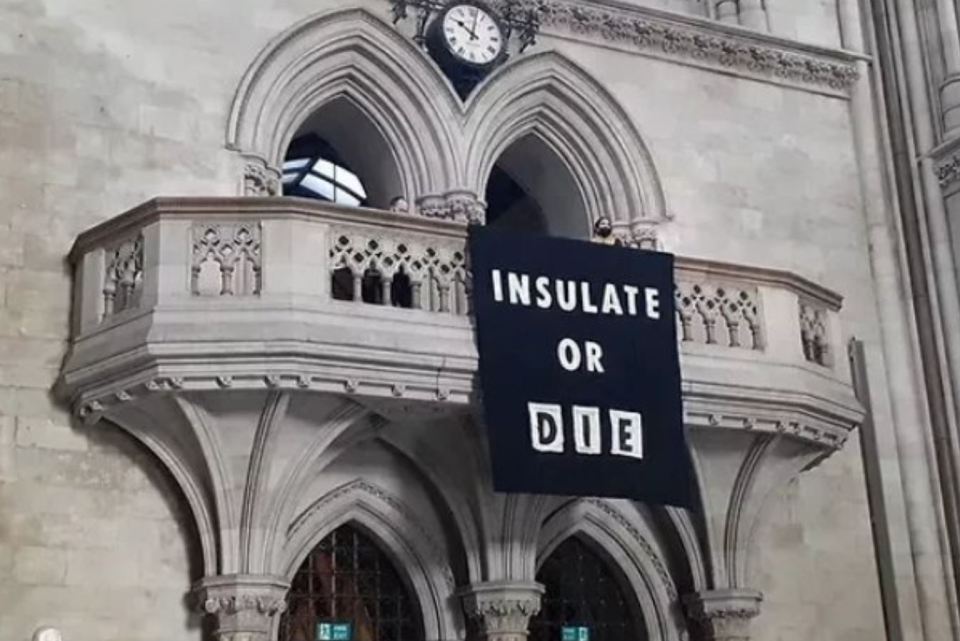A huge banner was unfurled outside the London court today