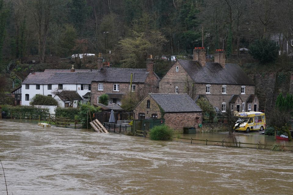 Waters of the River Severn edge towards homes in Ironbridge, Shropshire, as more wet and windy weather sweeps the UK