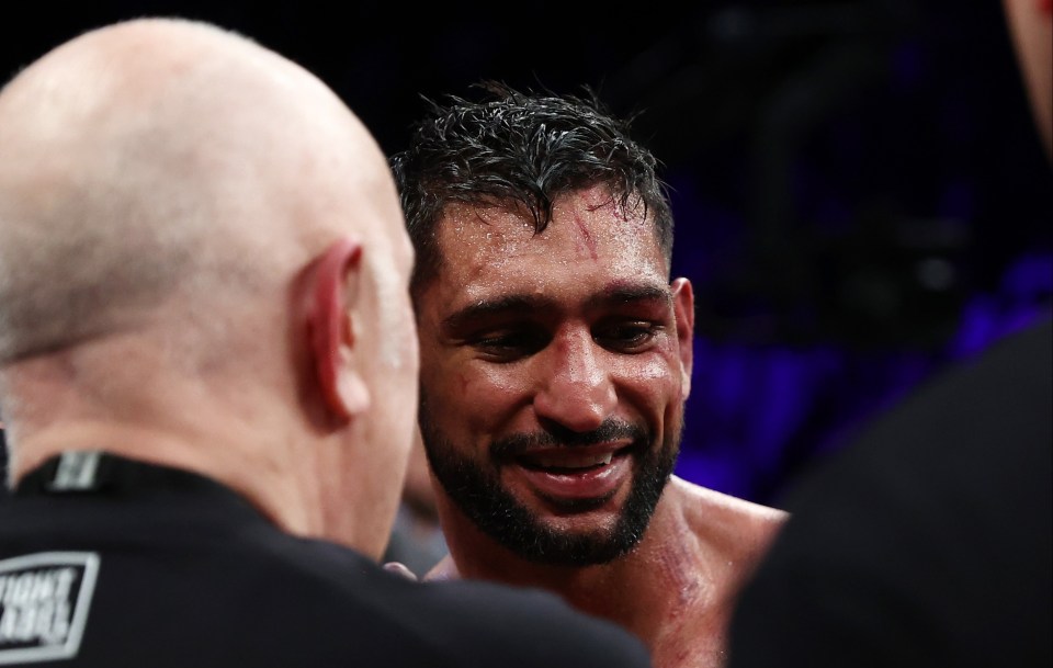 Amir Khan's face shows the damage of six rounds of boxing