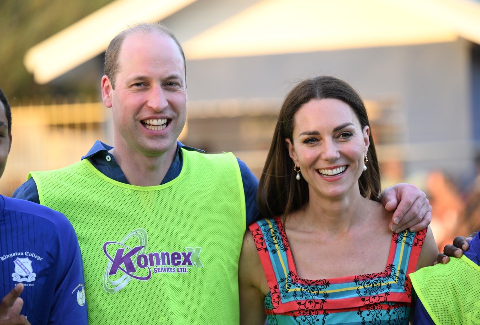 Proud Kate beamed from the sidelines as she watched her hubby