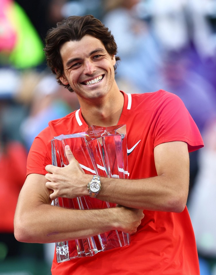 Taylor Fritz hugs the trophy after securing his maiden Masters 1000 title