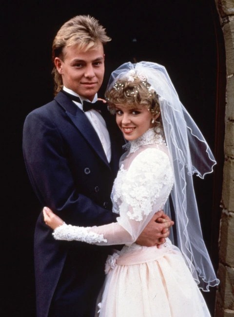 A bride and groom embracing on their wedding day.