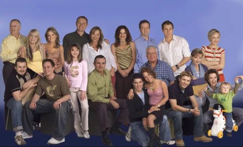 Large group photo of the cast of a television show.