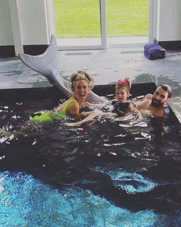 Rylan Clark popped on a mermaid's tail to go for a swim with his cousin Kimberley and her child