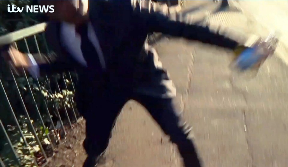 Mills lobbed the camera across the road