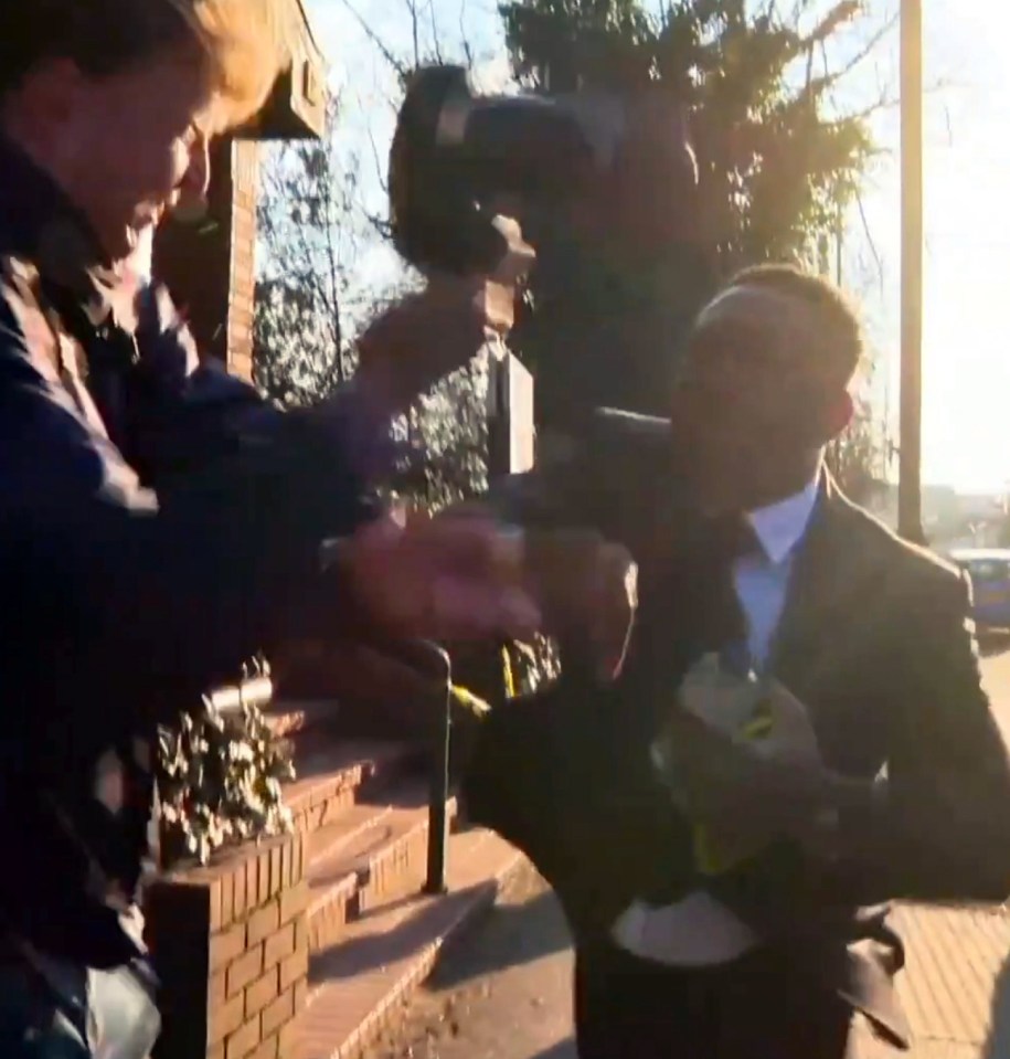 Shock footage shows the moment Dizzee Rascal grabs a photographer's camera and smashes it to the ground outside court