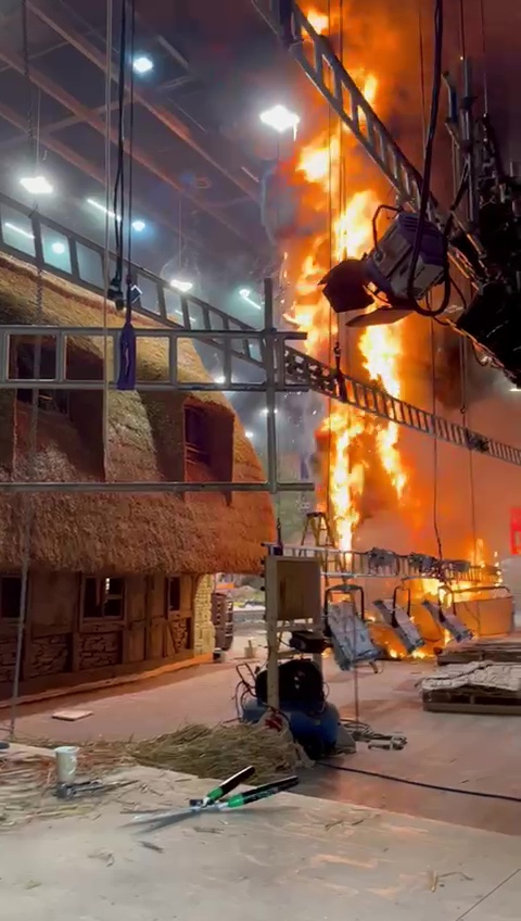 Lighting fixtures and electronics sway in the smoke.