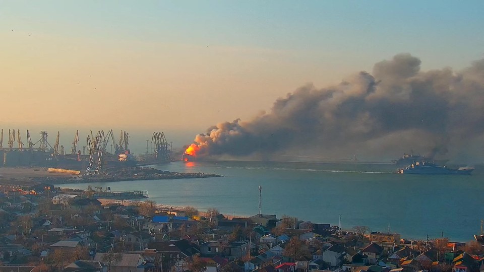 Smoke billows from a fire on a Russian ship in the port of Berdiansk