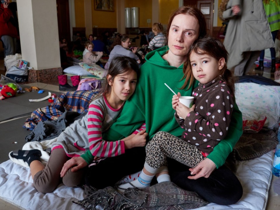 Mum Alona Yeskova, 33 cuddles daughters Miroslava, five, and Sophie, nine