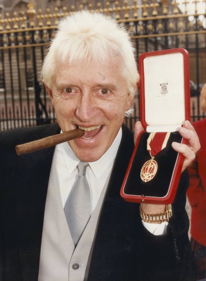 Jimmy Savile outside Buckingham Palace after his knighthood from the Queen