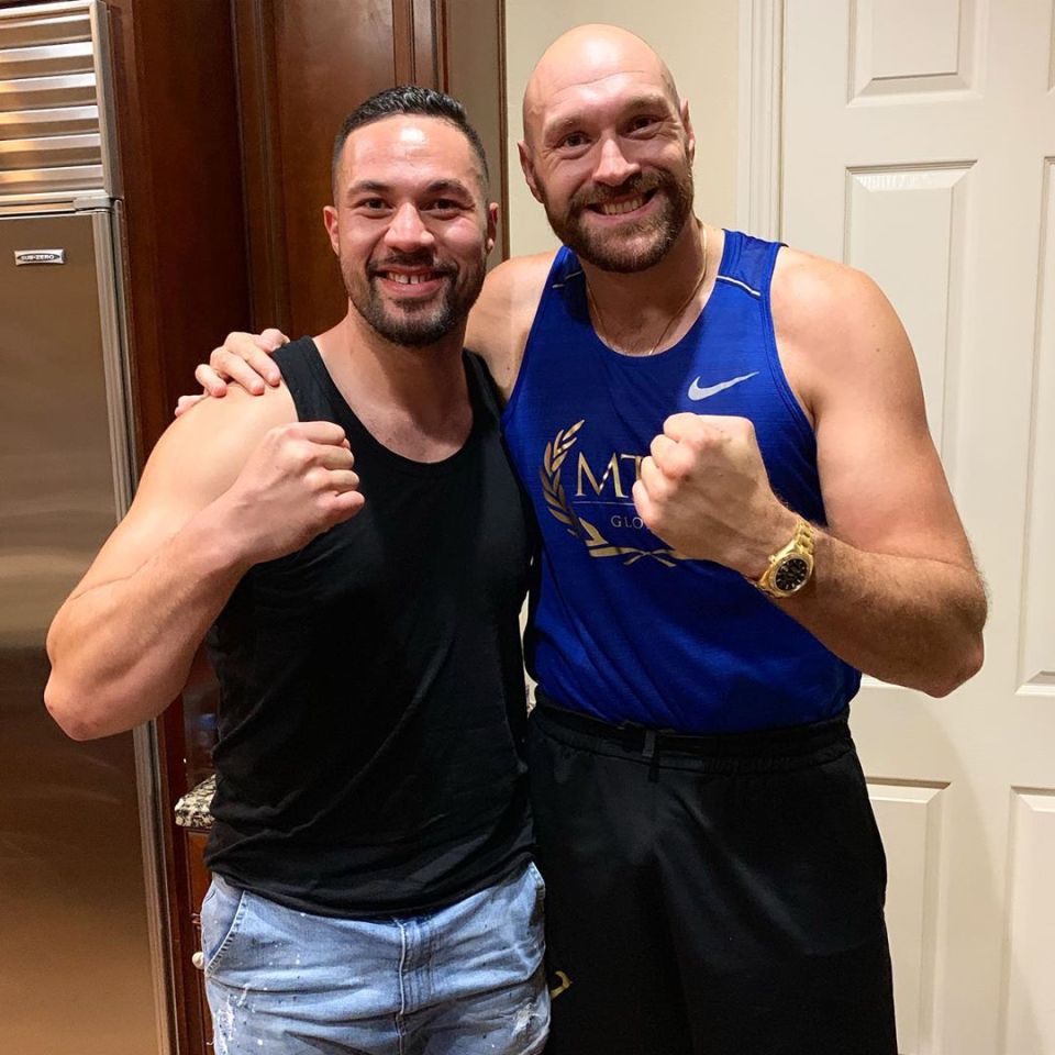 Joseph Parker and Tyson Fury posing together.