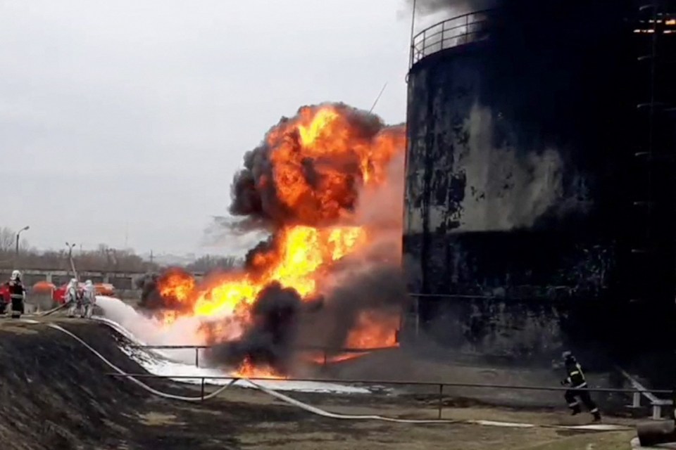 Crews try to put out the fire at the depot