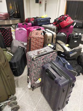 Hundreds of bags were lying around the airport after people had been forced to leave without them