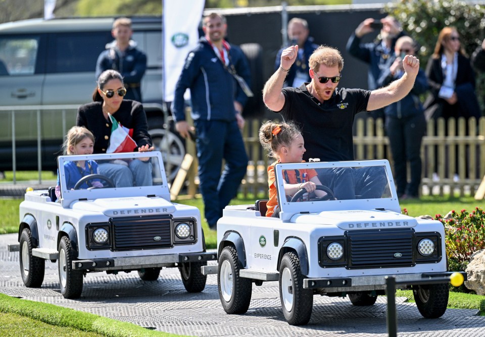 The Sussexes being chauffeured by two young children