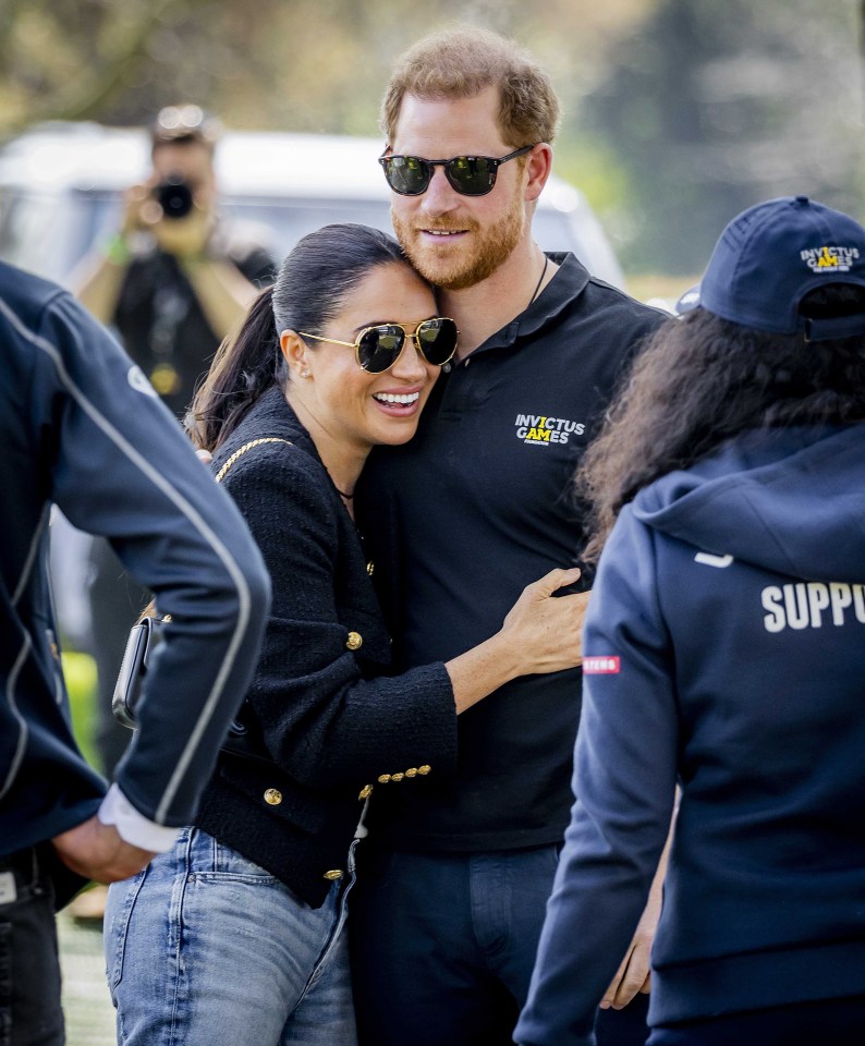 The Sussexes embrace on day one of the Games