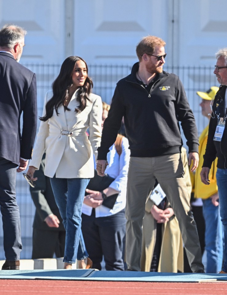 The couple held hands as they arrived for day two of the competition