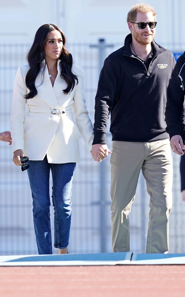The couple held hands as they arrived at the Athletics Park