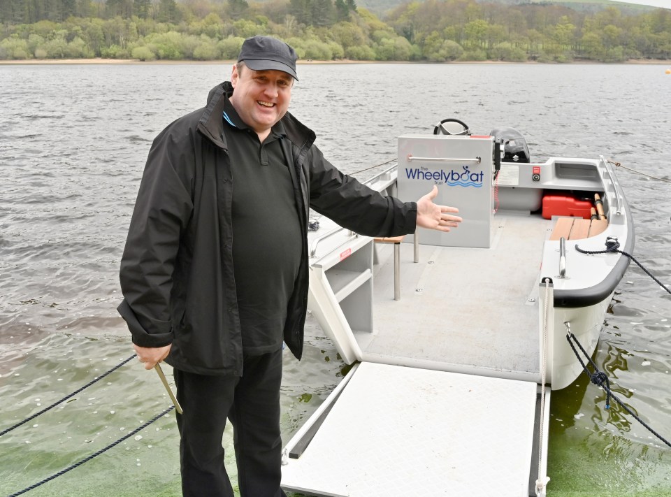 Comedian Peter Kay has made a rare public appearance to launch a Wheelyboat