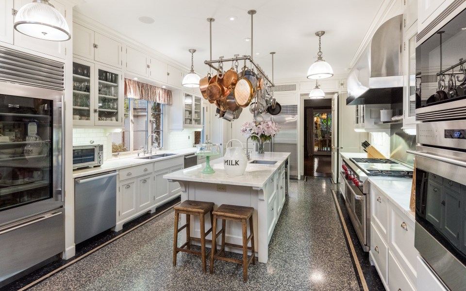The huge kitchen follows a white colour scheme