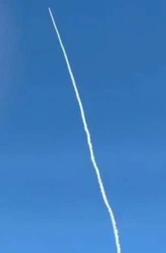 A pilot captured the moment a Chinese rocket came streaming towards their passenger plane