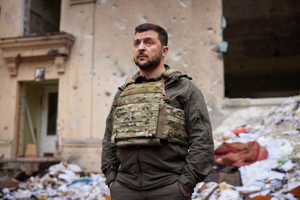 President Zelensky was pictured in a bullet-proof vest surveying ruins in Kharkiv