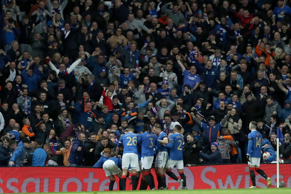 Rangers players celebrate their third goal. Absolute limbs.