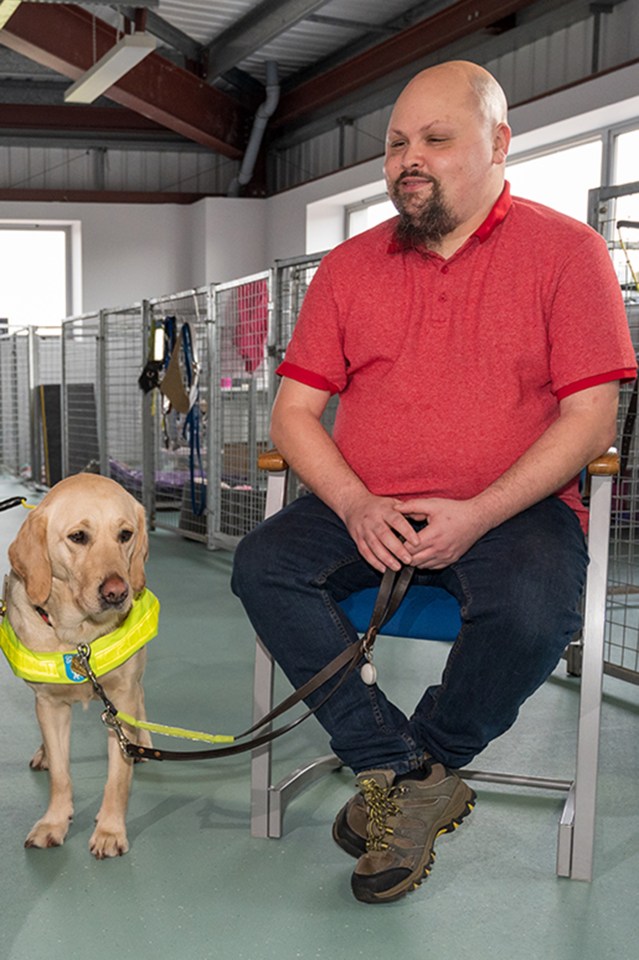 Fraser with guide dog Mabel - who together help other people with sight loss