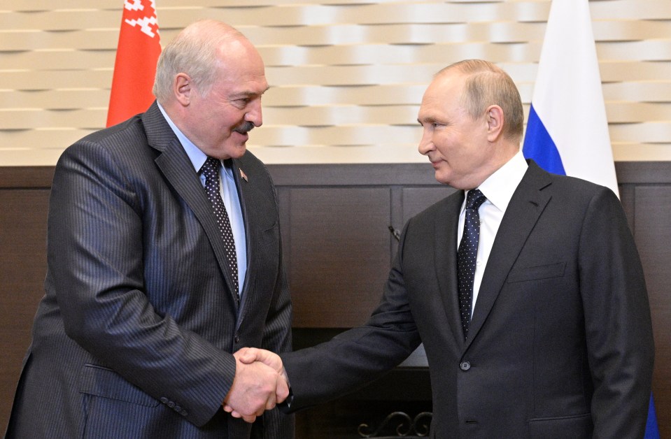 Alexander Lukashenko shaking hands with Vladimir Putin