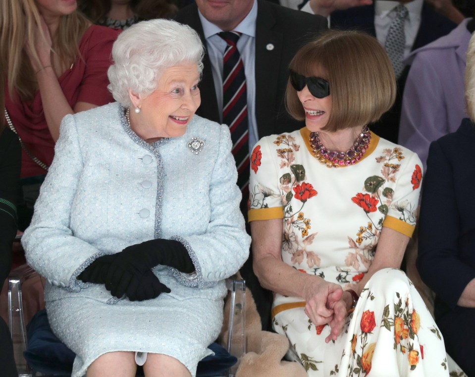 Biographer Amy writes how Anna is known for her "nit-picking." Pictured with the Queen at London Fashion Week