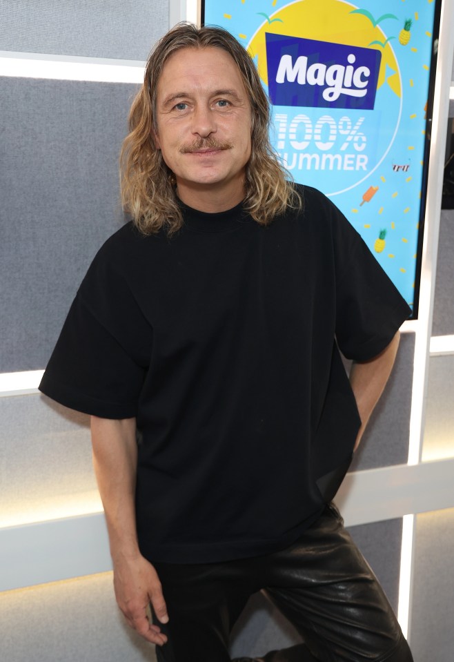 Take That singer Mark Owen looks totally different with long hair and a moustache
